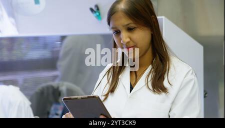 Beautiful scientist using digital tablet in laboratory Stock Photo