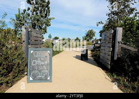 Sign at Tunnel Tops Outpost Playground, a picnic and play area with creative structures and Golden Gate Bridge views; chalk sign with hours and rules. Stock Photo