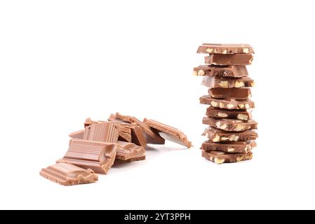 Tasty morsel of milk chocolate with nuts. White background. Stock Photo