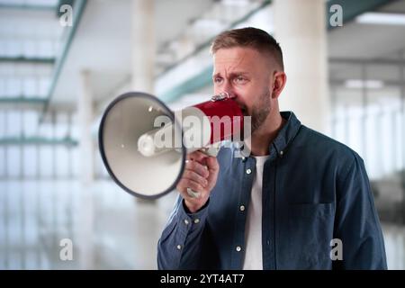Man Making Megaphone Announcement. Warning Concept Speaker Stock Photo
