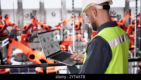 Men In Automotive Car Factory Using Scada System Stock Photo
