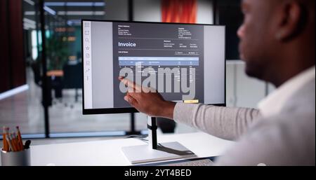 E Invoice Business Management. Accountant Using Electronic Invoice Stock Photo