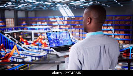 Engineer Worker Using Warehouse Automation Dashboard In Logistic Center Stock Photo