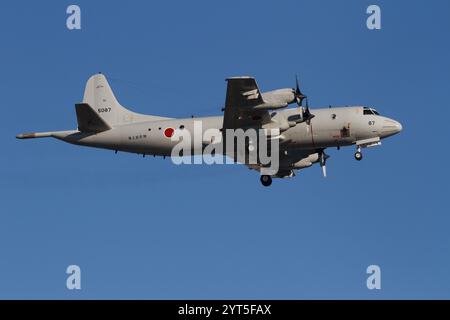 A Lockheed P-3C Orion Maritime reconnaissance aircraft with the Japanese Maritime Self Defence Force (JMSDF) flying near NAF Atsugi airbase. Japan Stock Photo