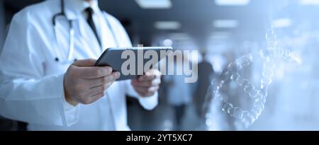 A doctor holds a tablet, reviewing patient data and medical reports. The modern use of technology in healthcare improves diagnostics and patient care. Stock Photo