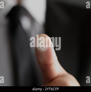 Man pressing finger to surface showing friction ridges pattern, closeup. Scanning fingerprint Stock Photo