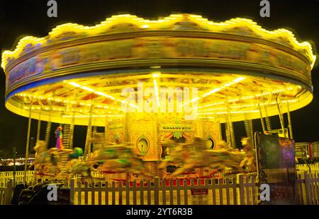 A whirling carousel on Brighton Pier, England Stock Photo