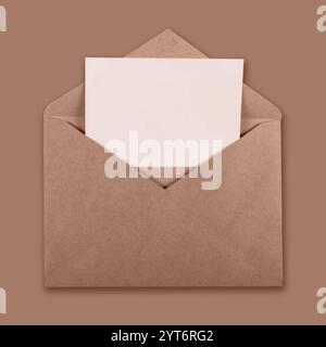 Recicled brown craft envelope with white blank card inside Stock Photo
