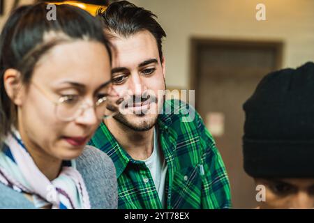Creative millennial colleagues collaborating on a project in a modern coworking space Stock Photo