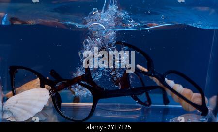 Broken glasses in a small aquarium. Stock Photo