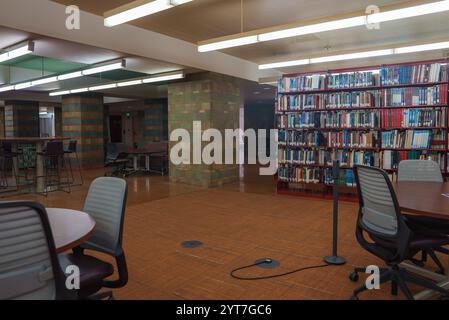 Modern Library Interior with Colorful Chairs and Organized Bookshelves ...