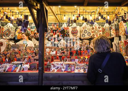 London, UK. 06th Dec, 2024. Tourists and visitors stroll along the many festive gift, food and drink stalls at the Trafalgar Square Christmas Market on Saint Nicholas Day, also called the Feast of Saint Nicholas. The 6th of December is celebrated in many Western Christian countries honouring St Nicholas of Myra, a bishop with the reputation of being a generous bringer of gifts. Credit: Imageplotter/Alamy Live News Stock Photo