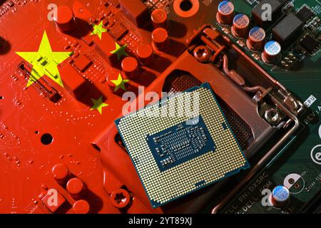 Flag of the Republic of China on a red painted pc motherboard with a CPU. Concept for supremacy in global microchip and semiconductor manufacturing. I Stock Photo