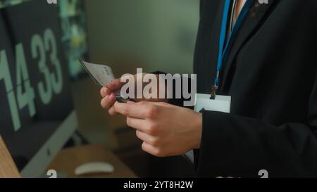 Unrecognizable woman concierge worker hotel reception give flight ticket check passport registration service tourist traveler passenger man arrive Stock Photo