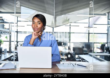 African American business woman executive working on laptop in office. Portrait. Stock Photo