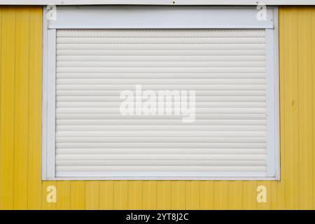 Window with closed roller shutter Stock Photo