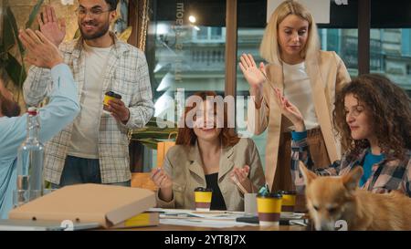 Happy diverse multiracial freelance coworkers colleagues friends creative team business men women male female group pet friendly coworking teamwork Stock Photo