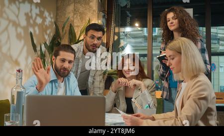 Multiracial creative team coworkers office colleagues coworking group students freelance architects business men women girls guys male female talking Stock Photo