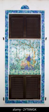Mural made of azulejos, painted ceramic tiles, on a house wall in Odeceixe in the Algarve, Portugal. Stock Photo