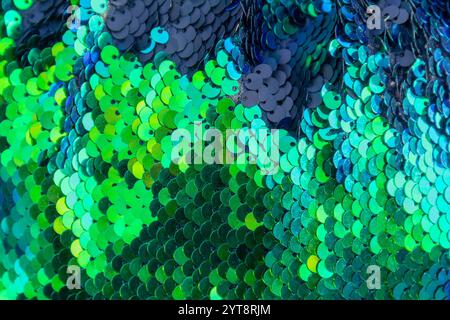 Full frame abstract background showing lots of green and blue reflective sequins Stock Photo