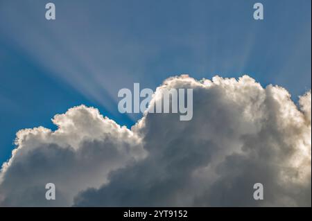 The sun's rays break through the clouds Stock Photo