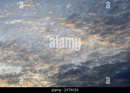 Altocumulus floccus clouds at dusk Stock Photo
