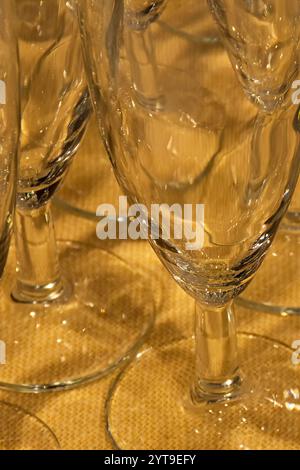 Reflections in glasses on a yellow tablecloth Stock Photo