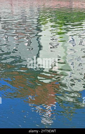 In the water mirror - The Heilig-Geist-Spital in Landshut is reflected in the Isar river Stock Photo