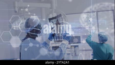 Image of data processing with molecules and brains over diverse surgeons in hospital Stock Photo