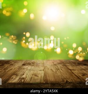Spring background with sun and yellow bokeh in front of an empty wooden table for a concept Stock Photo