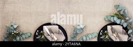 Festive table setting decorated for summer wedding in natural boho style.Top view background concept for wedding celebrations and vacations gastronomy. Restaurant dekoration. Flat lay, top view, long horizontal. Stock Photo