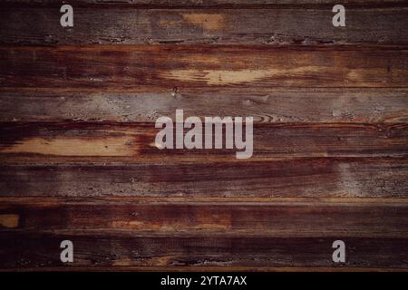 Background of horizontal old dark wooden planks. Weathered wooden structure. Stock Photo