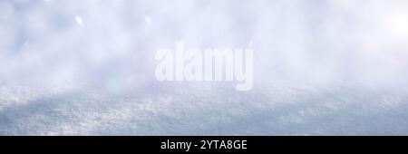Snow texture with shadows winter background. Natural white snow crystals in winter. Snow powder. Vertical christmas background. Stock Photo