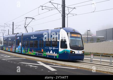 Bellevue, WA, USA - December 4, 2024; Sound Transit Link light rail train in Travel Partners Amazon Microsoft livery Stock Photo