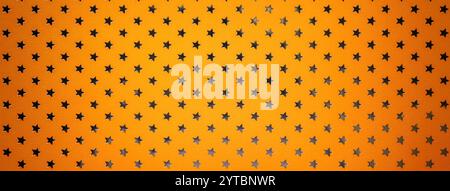 Orange background from metal foil paper with a pattern of silver sparkling stars closeup. Texture of bright yellow metallized wrapping holiday paper s Stock Photo