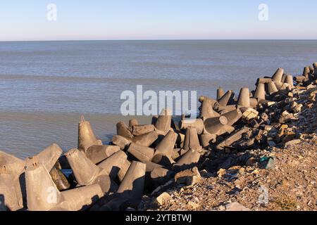 Concrete breakwater on the shore of the Caspian Sea. Sumgayit city. Azerbaijan. Stock Photo