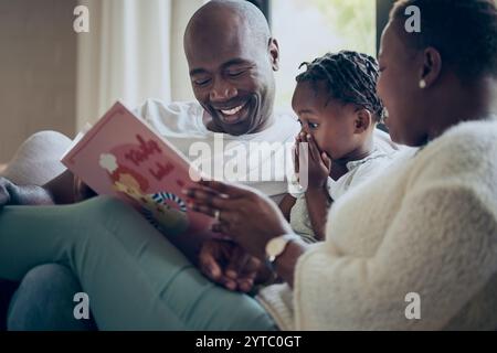 Father, child and book in shock on bed for story time, reading or ...