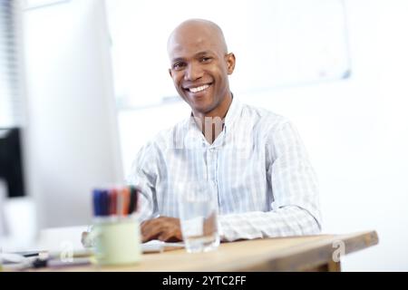 Smile, portrait and black man at computer for web design, research or business professional in office. Programmer, software developer or happy Stock Photo