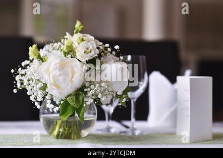 Beautiful romantic wedding table setting with white flower bouquet Stock Photo