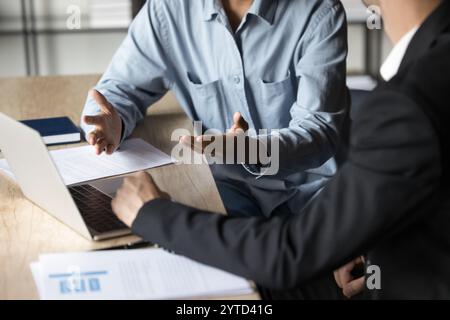 Cropped view two traders analysts discussing market trends Stock Photo