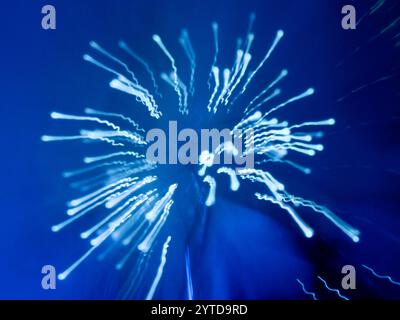 Abstract blue light streaks against a dark blue background Stock Photo