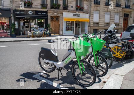 A fleet of about sixty Velib shared bicycles, are lined up neatly at a docking station in Paris, France Stock Photo