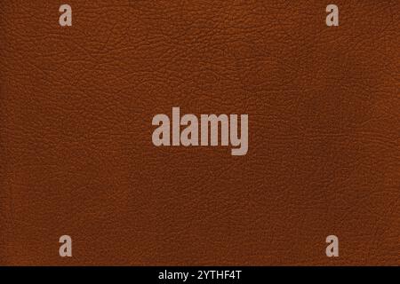 Natural, genuine solid orange leather texture close up, macro. Structure of matte leatherette, artifical skin surface with embossing pattern. Backgrou Stock Photo
