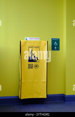 Evac Chair emergency stairway evacuation aid for helping mobility impaired people exit a multi storey building in the event of a fire alarm. Stock Photo
