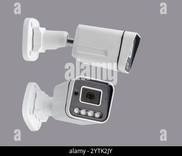 surveillance security camera isolated on gray background in different projections Stock Photo