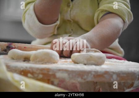 Female hands knead the dough for bread Stock Photo