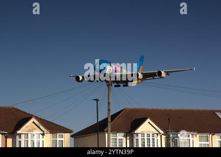 Emirates Airbus A380-861 A6-EES from Dubai DXB with Destination Dubai livery flies low over Myrtle Avenue on final approach before landing at LHR. Stock Photo