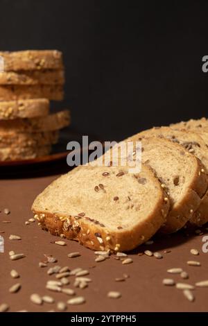 Bread from wholemeal flour and seeds sunflower, flax, sesame. Creative food idea, background texture Stock Photo