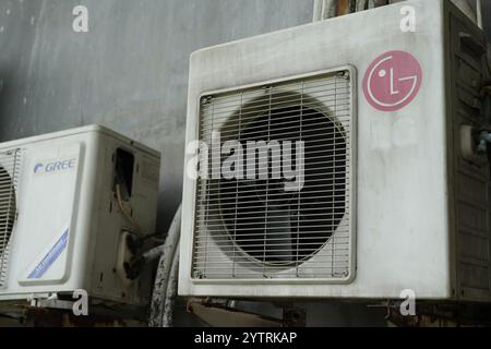 Jakarta, Indonesia- 22 November 2024: old unit of LG brand AC outdoor unit on the outside. Stock Photo