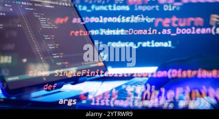 Abstract software development concept with code and laptop on blurred background representing programming, coding Stock Photo